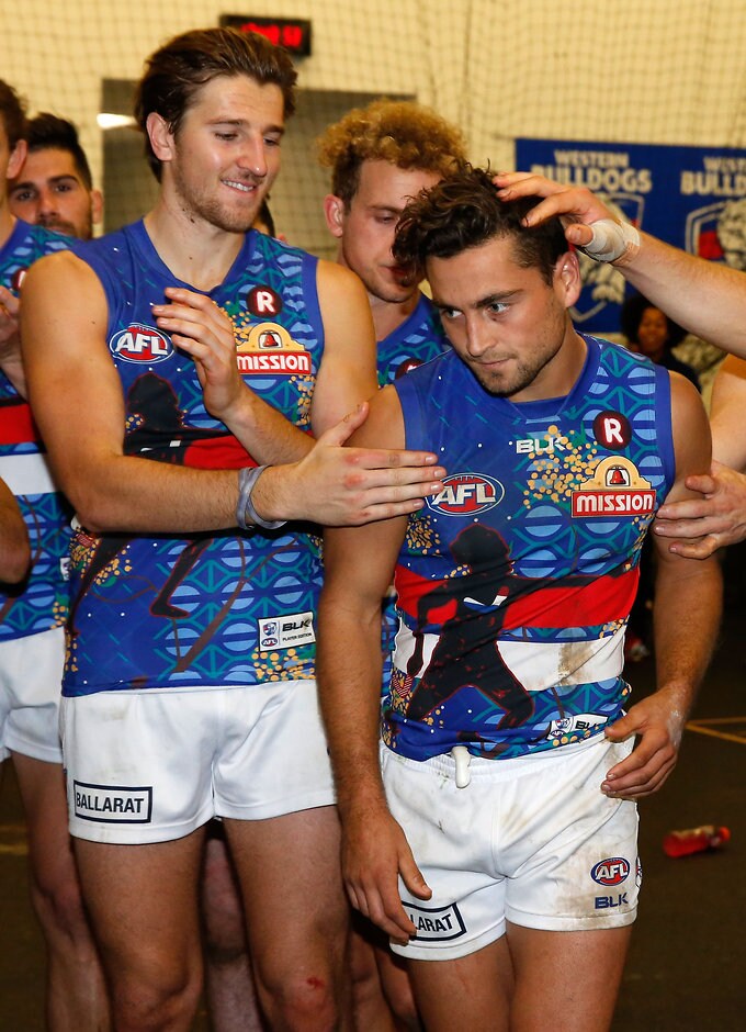 AFL 2016 Rd 10 - Collingwood v Western Bulldogs MELBOURNE, AUSTRALIA - MAY 29: Luke Dahlhaus of the Bulldogs receives the Bob Rose�Charlie Sutton Medal during the 2016 AFL Round 10 match between the Collingwood Magpies and the Western Bulldogs at the Melbourne Cricket Ground on May 29, 2016 in Melbourne, Australia. (Photo by Adam Trafford/AFL Media)